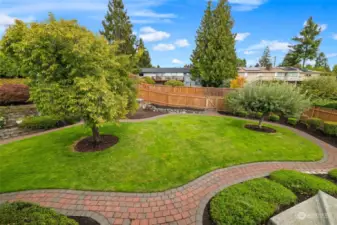 Lovely, manicured backyard is fully fenced