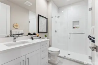 Lower floor bathroom has a beautiful shower. Photos are for representational purposes only.  Colors and options may vary.