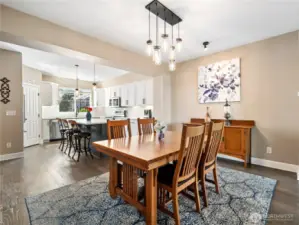 The heart of the home awaits in this spacious dining room, anchored by a beautiful craftsman-inspired dining set.