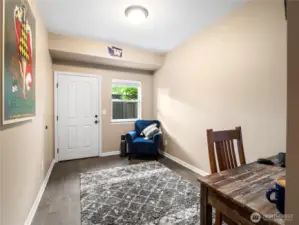 Downstairs, this cozy and inviting flex space perfect for a home office, reading nook, or guest retreat, with a large closet and access to the fenced back patio.