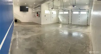 Garage parking area 23' wide 28'8" deep. Extra storage area 14'x13'. Comes with 78" TV for potential "person" cave!