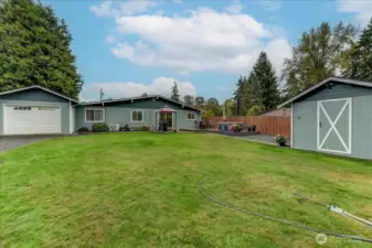 Great pic of the back yard and as you can see there is a garage door that accesses the large 50'x12' garage...