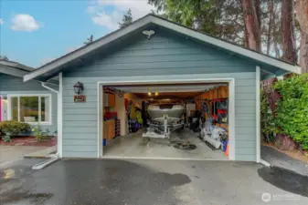This picture is to show you how large the garage is...that is a boat! It is a Tandem Garage, with access to the back yard. 50'x 12' 30A Electrical subpanel w/20A outlets. Double wide paved Driveway
