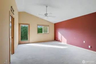 Primary bedroom with door to back yard.