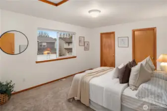 Primary bedroom. Peak-a-boo mountain views from window.