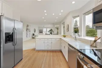Kitchen with new stove, microwave and dishwasher.