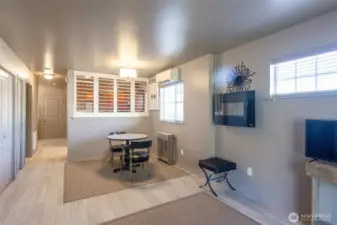 The fireplace on the wall creates a cozy warmth for those chilly nights.