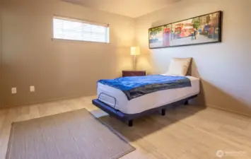 The owner's suite is spacious and can accommodate a large bed and dressers.