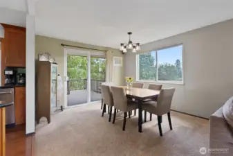 Dining room offers more of the beautiful views and access to the expansive entertaining deck.
