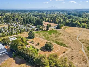 Aerial view of this special property. With no neighbors to the south, and light-ind warehouses to the north (that are typically active only during M-F business hours) this property is a great balance of close-in convenience and quiet country living.