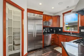 Kitchen w/ Pantry and Stainless Steel Appliances