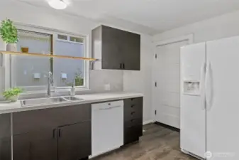 Back door from kitchen leads to fabulous backyard