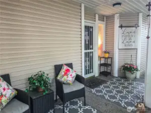 The covered porch leads to the front door, with lots of room for your personal decor, room for relaxing and conversation.