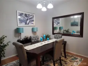 The formal dining room is just off the entry way and near the living room and kitchen.