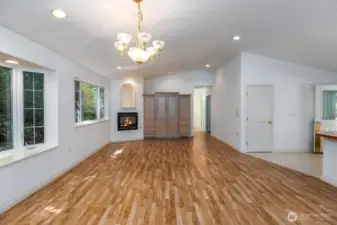 View from dining area over great room with cozy propane fireplace built in.