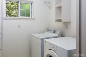 Laundry room is also adjacent to primary bedroom for convenience.