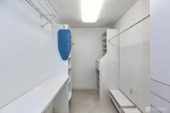 Large laundry room and closet off primary bedroom.