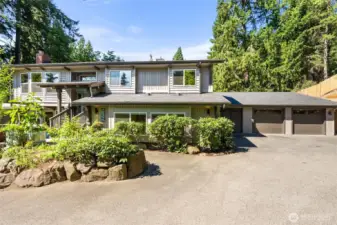 New roof with transferrable warranty.  Two-car garage with shop space or extra storage. Professionally landscaped spaces.  New fence!