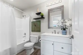 Main bath near additional bedrooms.