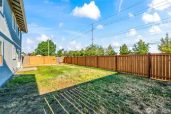Large backyard for playtime, barbecues, and gardening.
