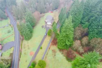 5.75 acres, outbuildings for chickens, small farm animals: goats, pigs, sheep, ducks, chickens  Access to creek and fruit trees, blueberry bushes, garden beds