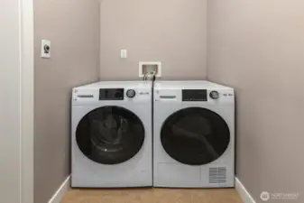 In unit washer/dryer with extra storage possibilities.