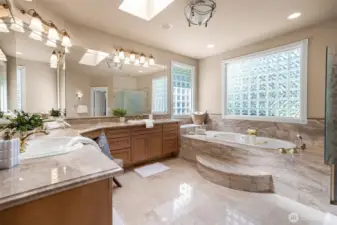 primary bath with jetted soaking tub, and all the desired amendities