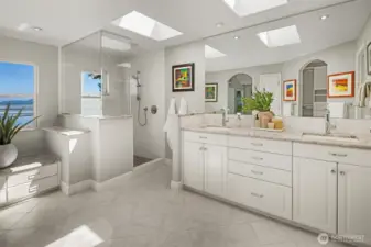 The primary suite has heating floors, dual sinks & walk-in shower