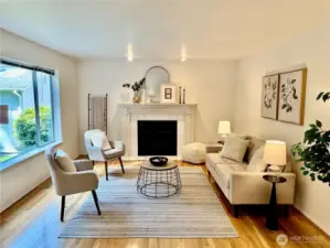 Cozy up by the beautiful white fireplace with classic mantel styling, a stunning focal point that anchors this open-concept living space and provides warmth for gatherings year-round.
