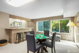 A bar, new carpet and paint, wood burning stove and great light enhance this space.