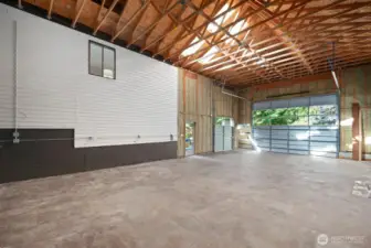 The space is large enough to hold a full size pickle ball court. It was originally designed to be a glass blowing studio with large doors for ventilation.