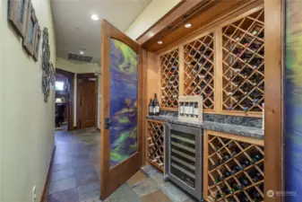 The elaborate double-door wine cabinet storage, lockable with beautiful swirl film glass insert