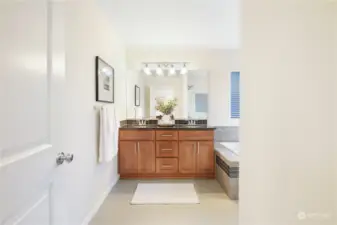 Ensuite bathroom with soaking tub and dual sinks