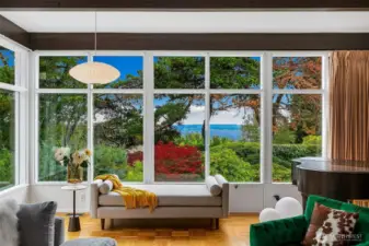 From the west-facing windows of 4221 W Armour, the view expands across the shipping lanes of Puget Sound to Bainbridge Island and the Olympic Mountains beyond. Cargo ships glide silently past, their scale and motion a quiet reminder of Seattle’s maritime lifeblood—and of the ever-changing theater just beyond the glass.