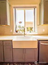 UPGRADED FARM SINK...WINDOW OVERLOOKS BEAUTY BACKYARD...YOU'LL ALMOST ENJOY DOING THE DISHES