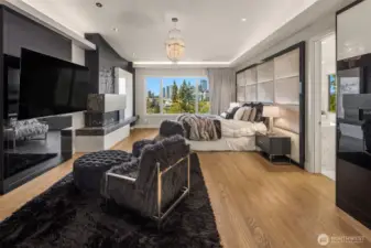 The primary suite is elegant and elevated. Beautiful city views, elegant draperies, wet bar and fireplace set the mood for relaxation.