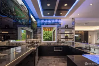 The bar is incredible with two built televisions, tons of seating around the bar, which has the most amazing lighting program. The bar is a highlight of the space.