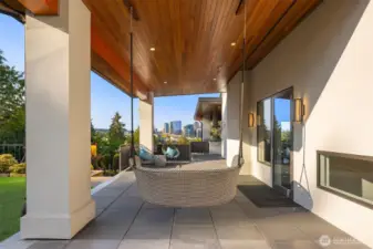 This quaint side patio is charming and is located off the family room. The ceilings on this overhang are so rich and beautiful.