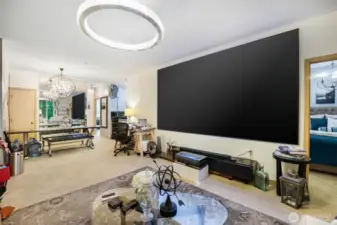 Another view of living room with 150 in TV (TV is available for purchase)
