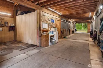 The 7 stall barn includes a hot/cold wash room, tack room, 25-ton hay storage and bathroom. The house and barn are served by a srandard generator that automatically runs the home and barn in the event of a power outage.