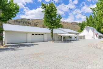 Massive insulated shop and 4-bay garage with office and heated bath—ideal for storage, projects, or work-from-ranch life, all surrounded by quiet and privacy.