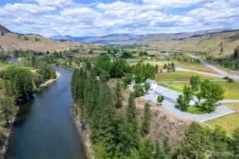 Looking upriver from above Marble Ranch—an extraordinary legacy property with sweeping Methow Valley vistas, fenced pasture, riverside forest, and room to live, work, and roam.