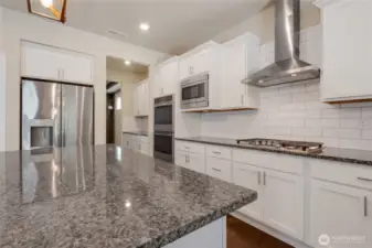 Kitchen leads to butler pantry and then off to the dining room