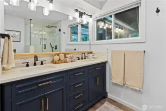 Downstairs remodeled bathroom with double sink and shower