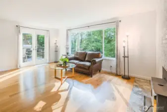 Living room looking toward French Doors opening to large deck