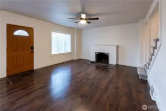 Upon entering you are greeted by gorgeous, gleaming floors and lots of natural light, plus a gorgeous wood burning fire place.