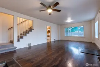 Large, great room style living and dining room leads to the kitchen.