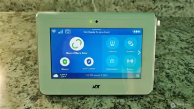 Security controller ADT on Kit Counter. be sure to re arm code in realtor info on listing