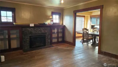 fireplace with insert and built in cabinets