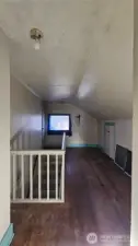 Upstairs hall way with bannister